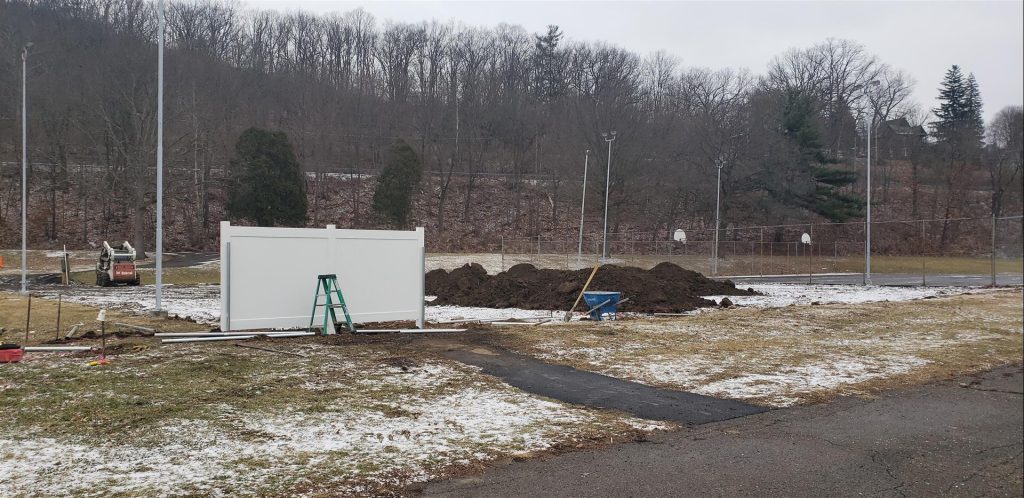 Village of Painted Post Craig Park Dog Park white fence being installed around piles of new top soil